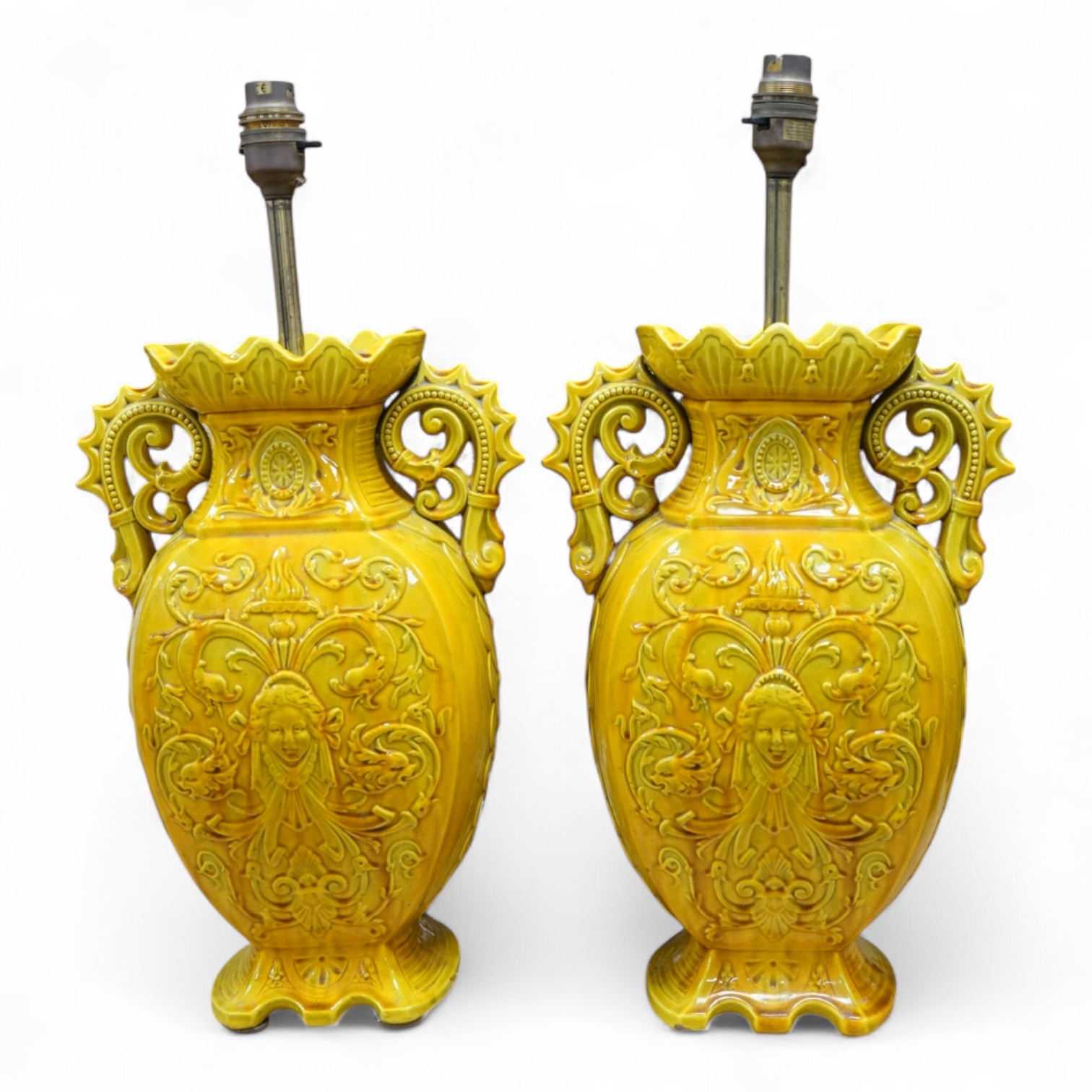 A pair of late 19th century Majolica yellow glazed vases, mounted as table lamps, marked ‘W & Co’ to base, 47cm total